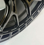 Close-up of Symmetry Forged Wheels - SF-12 - Gloss Black showcasing intricate design and finish.