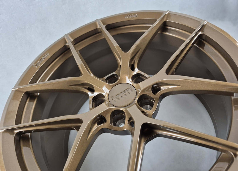 Symmetry Forged Wheels - SF-07 - Gloss Bronze close-up showcasing intricate design and finish.