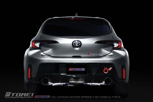 Tomei Expreme Titanium Exhaust System Type-D Dual For Toyota GR Corolla displayed on a sleek car from the rear view.